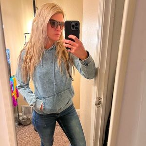 Jean sweater, size small, made with cotton/polyester/spandex.